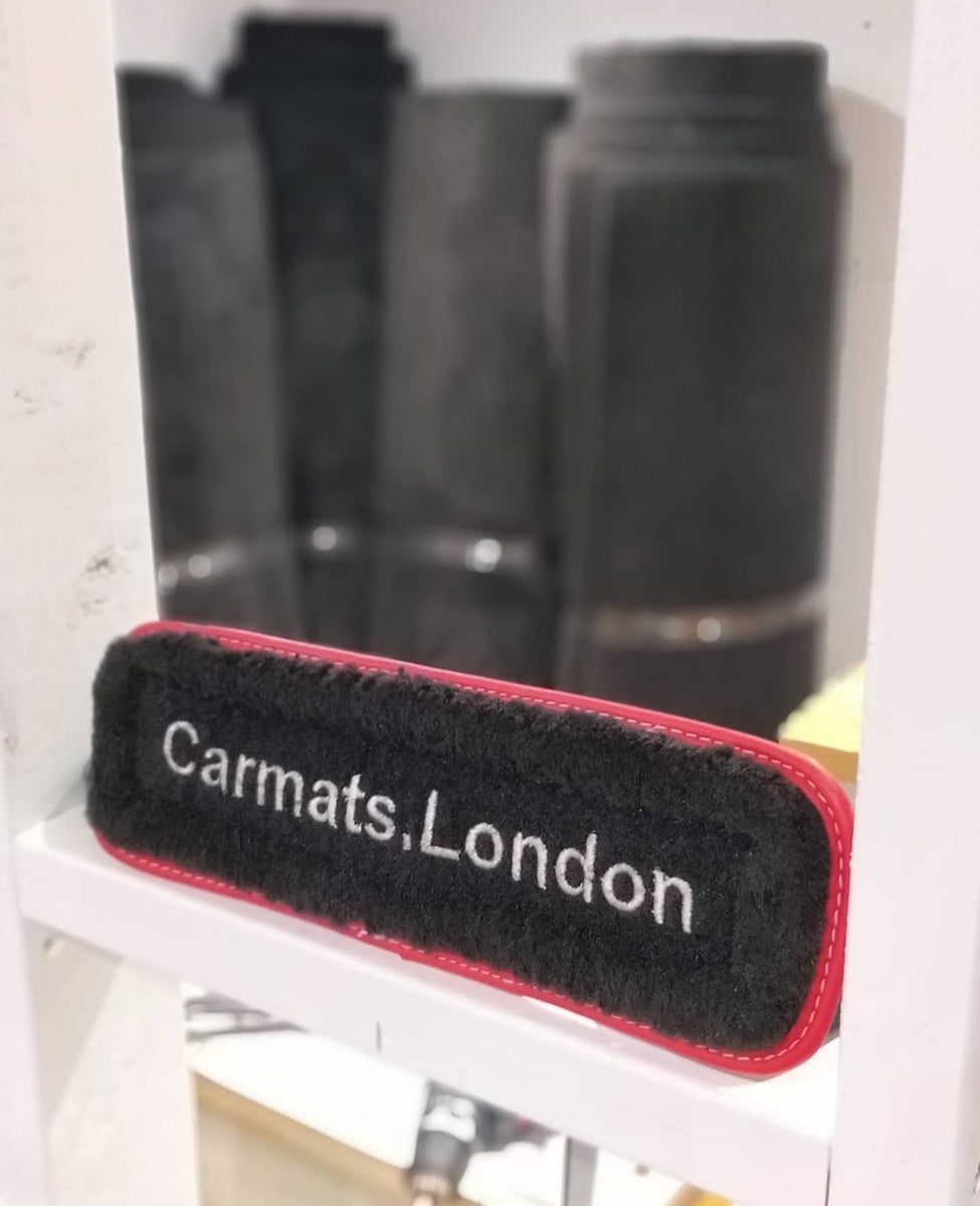 This image shows a custom made car mat display made from high quality carpet material. Manufactured in Britain to a high quality standard. Custom trim colour and custom stitching to enhance the look of the car mats. Carmats.London Londons Best Car Mats 